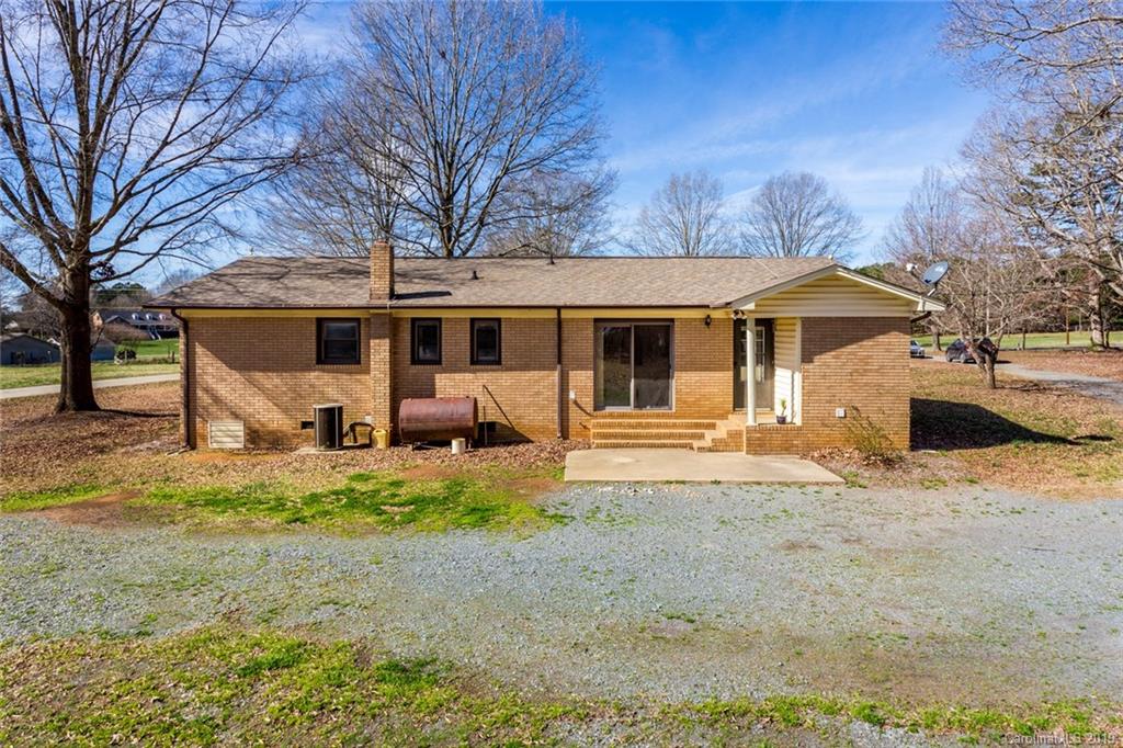 1314 Love Road Monroe, NC 28110 - Photo 6 of 36 a view of a yard with a large tree