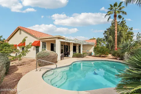 a house view with a swimming pool