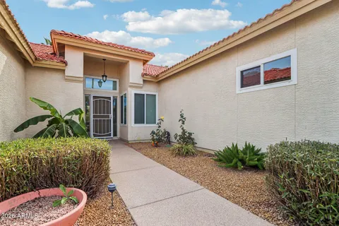 a front view of house with yard outdoor seating and barbeque oven