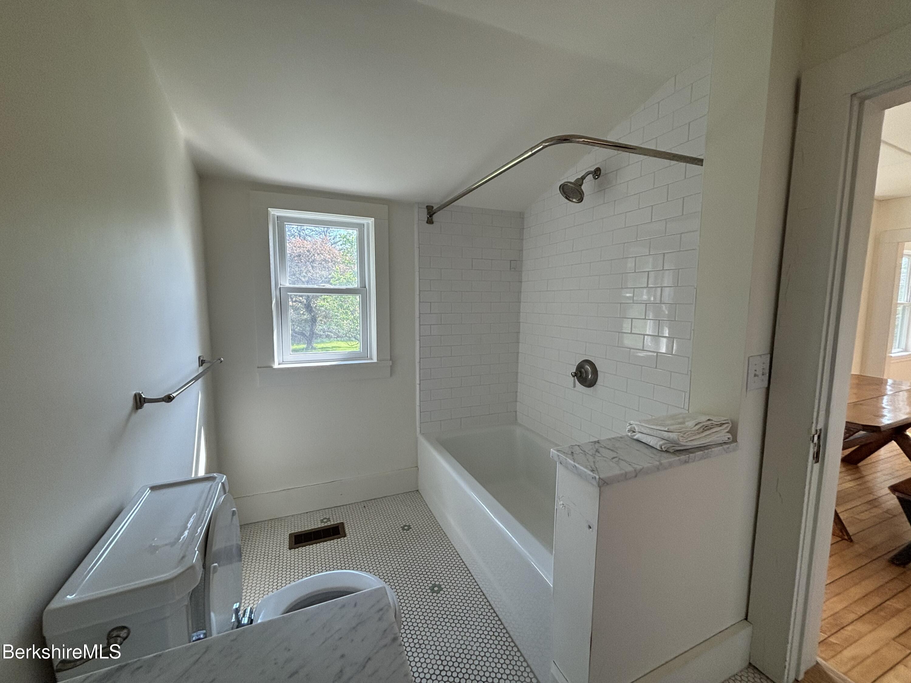 86 Miner Road Lanesborough, MA 01237 - Photo 34 of 44 a bathroom with a bathtub and shower