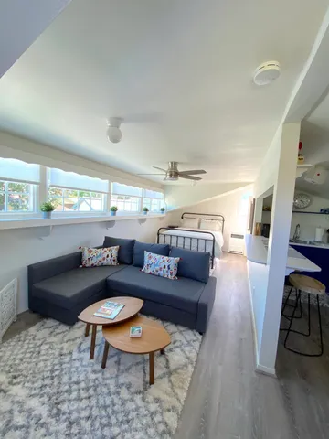 a living room with furniture and a table