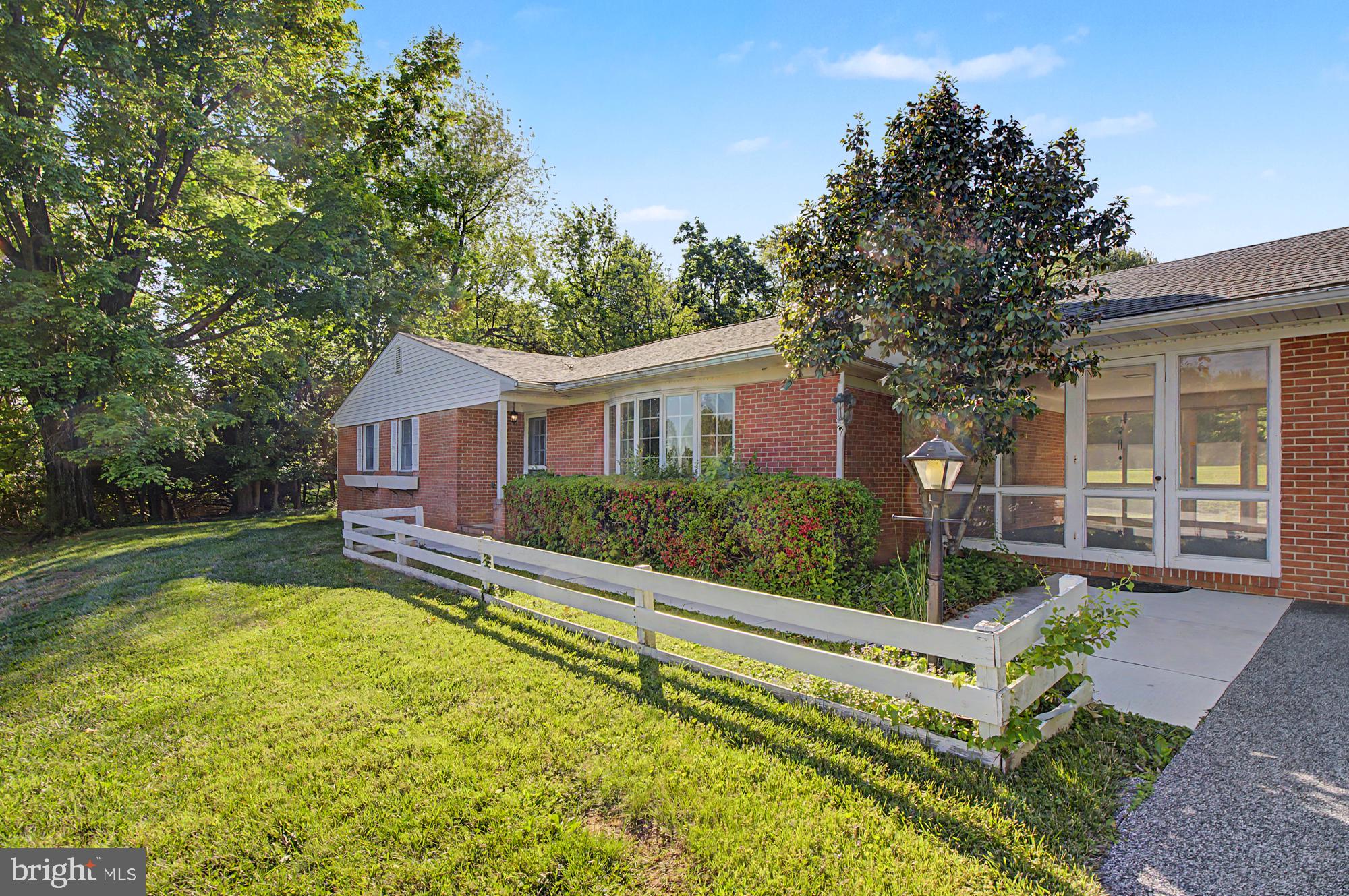 4602 Langshire Road Baldwin, MD 21013 - Photo 4 of 49 Charming brick home with lush greenery.