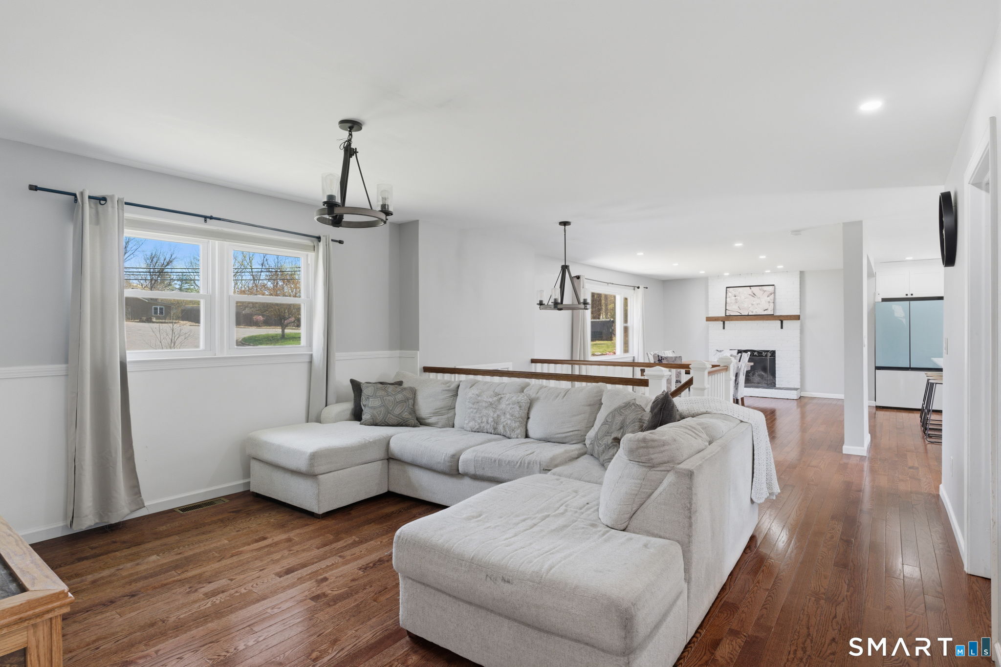 99 West Chippens Hill Road Burlington, CT 06013 - Photo 13 of 40 a living room with furniture and a chandelier