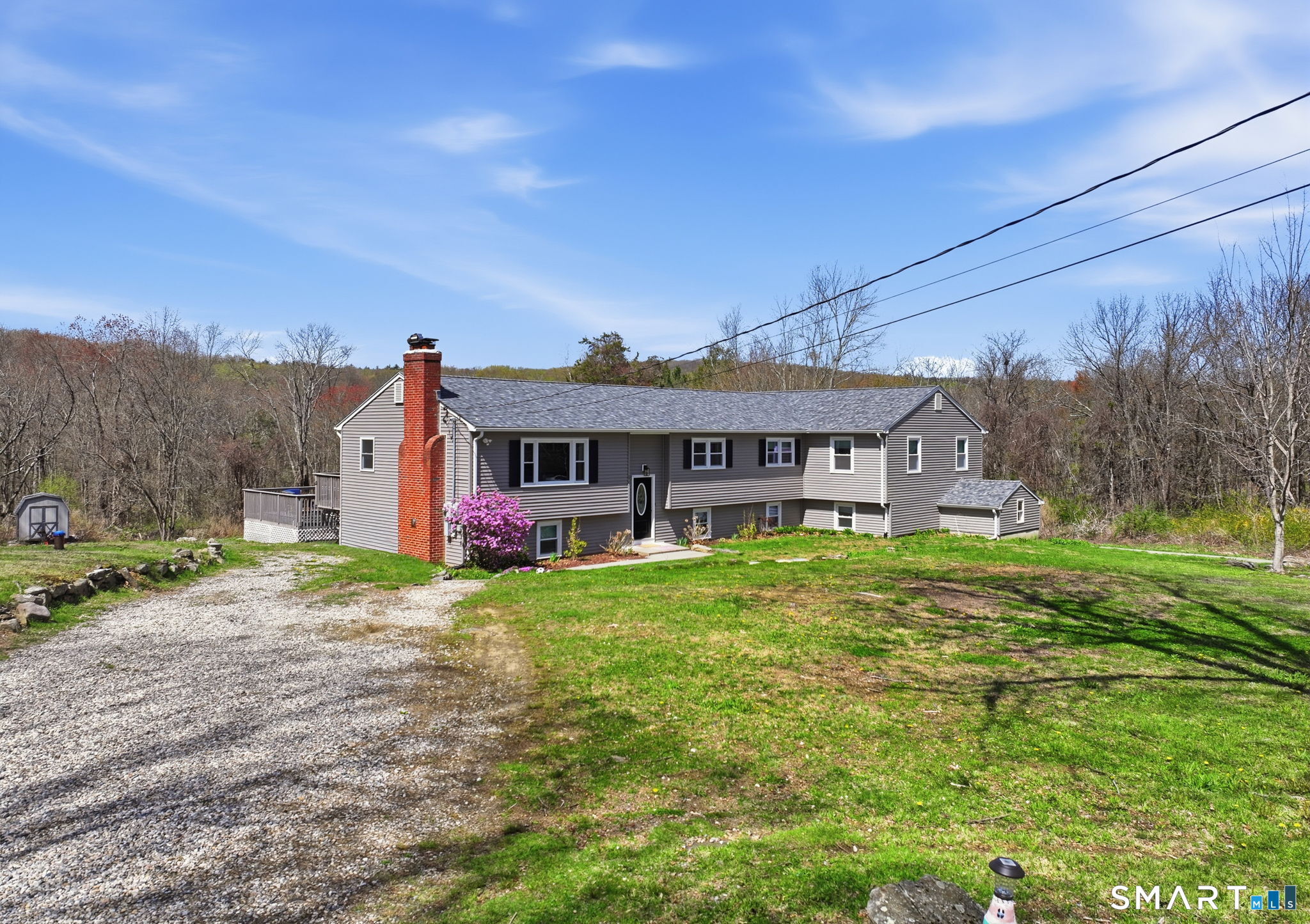 99 West Chippens Hill Road Burlington, CT 06013 - Photo 2 of 40 a front view of a house with garden