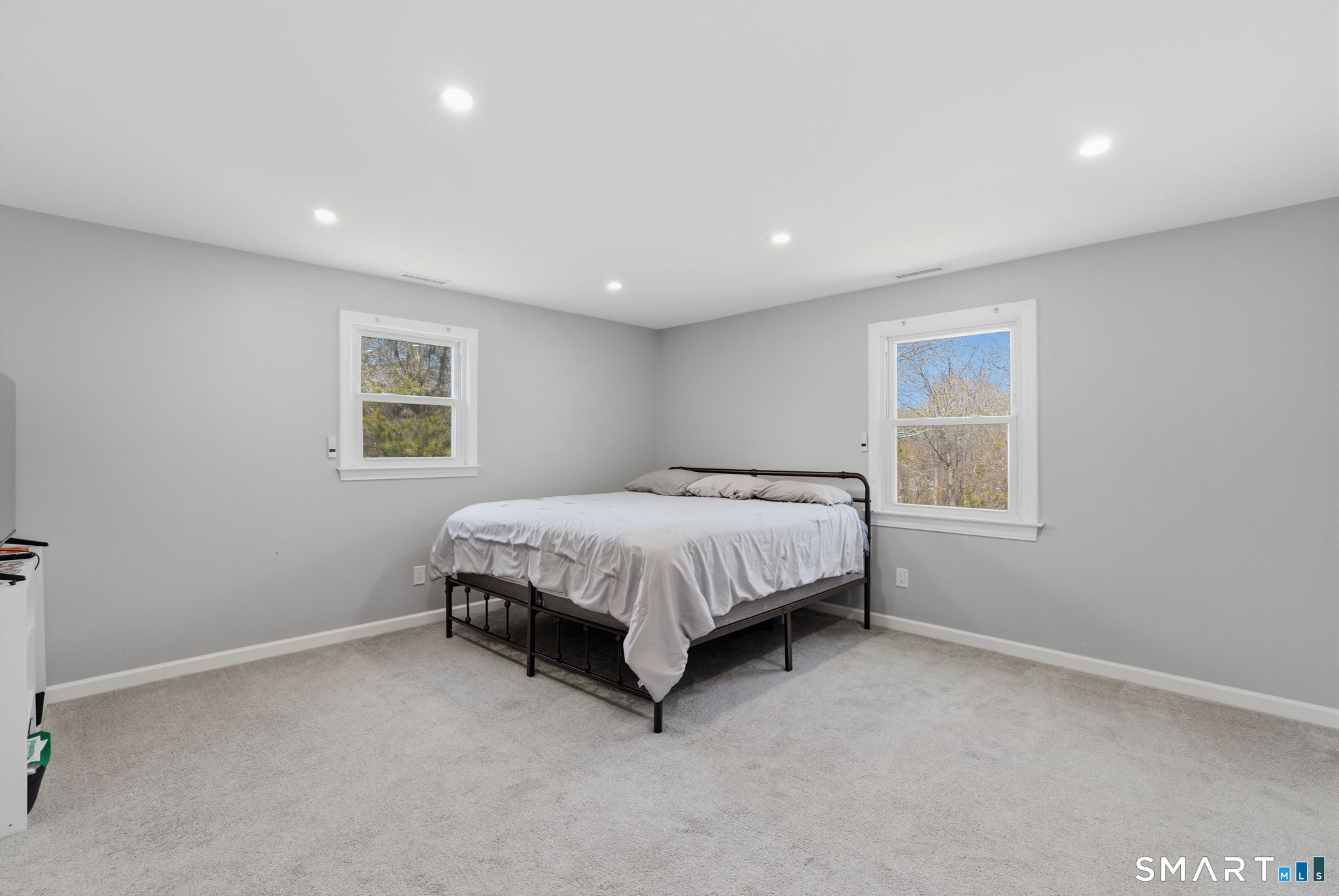 99 West Chippens Hill Road Burlington, CT 06013 - Photo 26 of 40 a bed sitting in a spacious bedroom next to a window