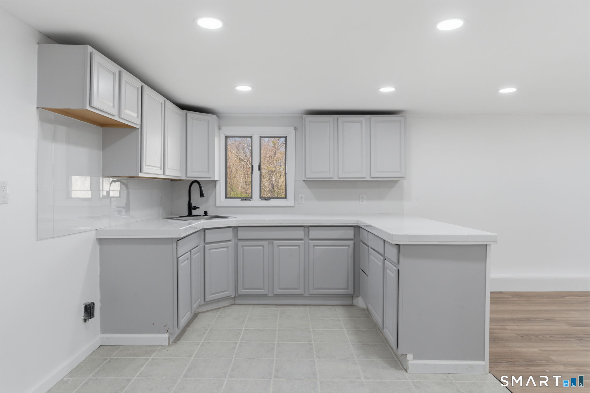 99 West Chippens Hill Road Burlington, CT 06013 - Photo 30 of 40 a kitchen with sink cabinets and window
