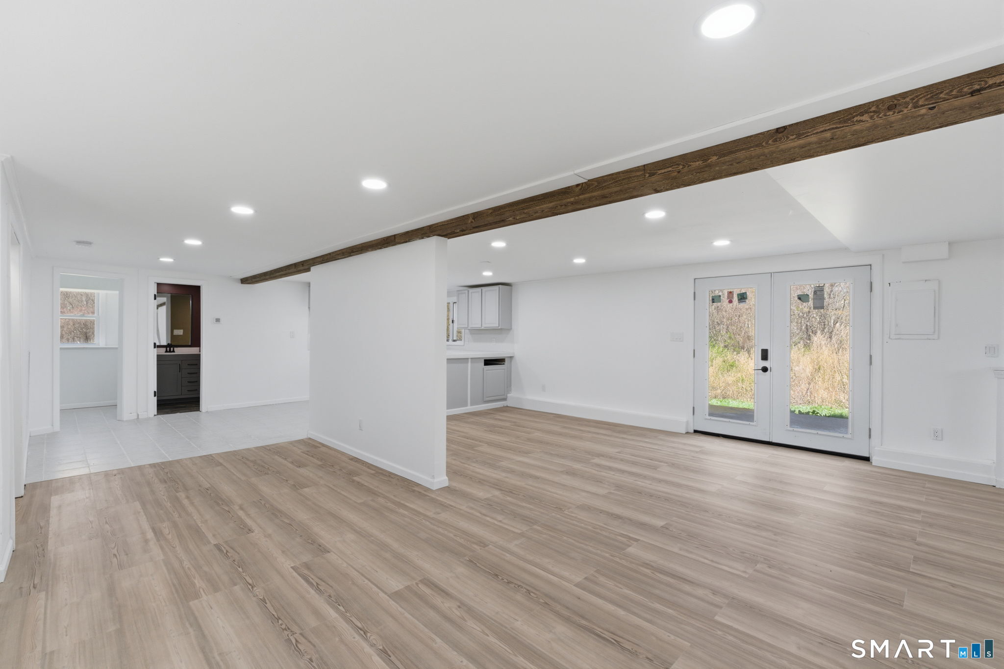 99 West Chippens Hill Road Burlington, CT 06013 - Photo 35 of 40 a view of a big room with wooden floor and windows