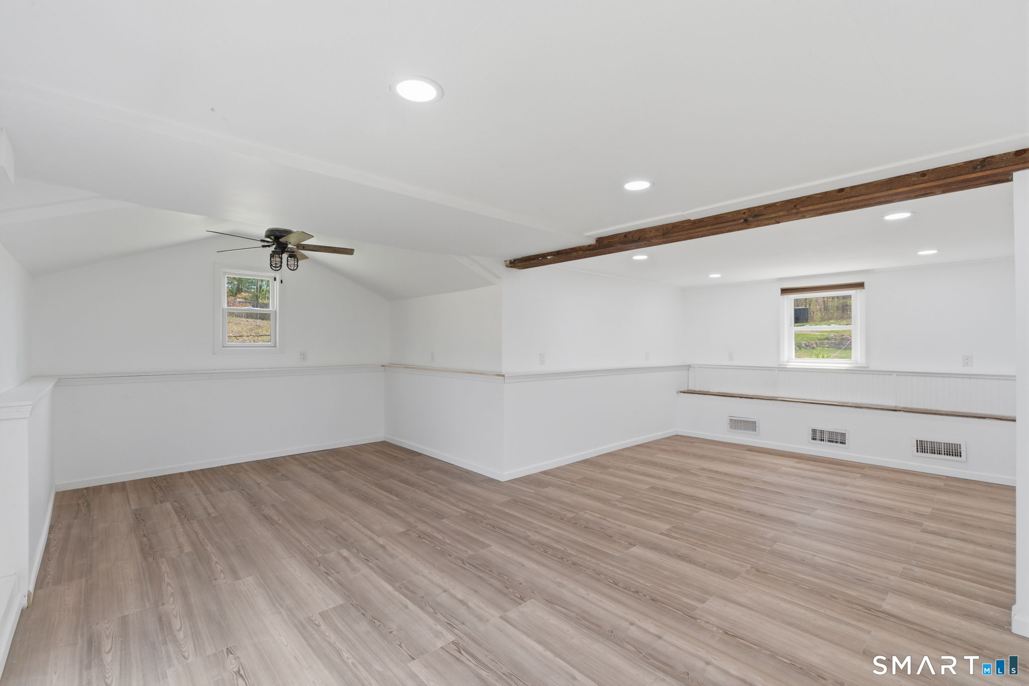 99 West Chippens Hill Road Burlington, CT 06013 - Photo 37 of 40 an empty room with wooden floor and windows