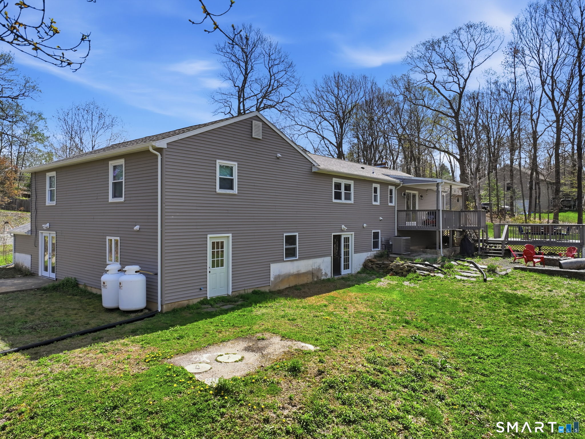 99 West Chippens Hill Road Burlington, CT 06013 - Photo 5 of 40 a backyard of a house with table and chairs