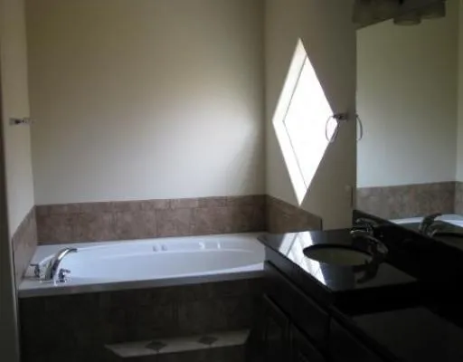 a bathroom with a sink and a bathtub