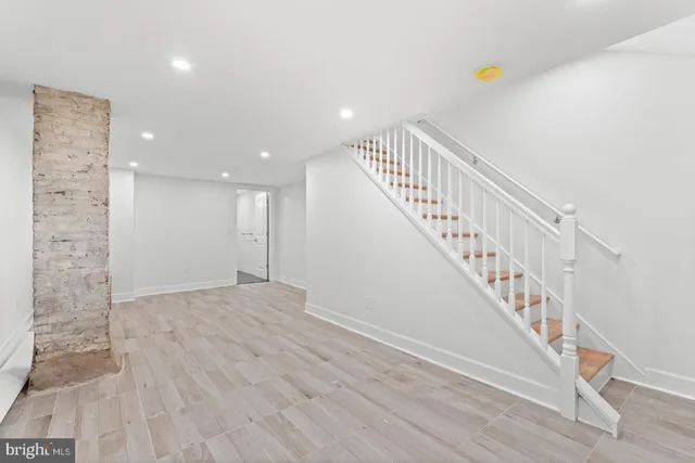 a view of an entryway with wooden floor