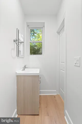 a utility room with a sink dryer and washer