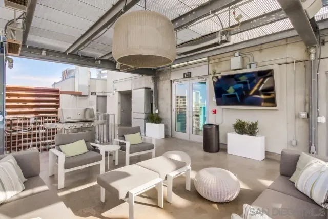 a view of a patio with a table and chairs
