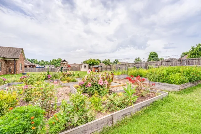 a view of a garden with houses