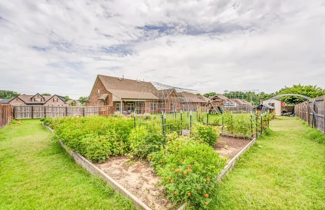 a view of a swimming pool with a garden