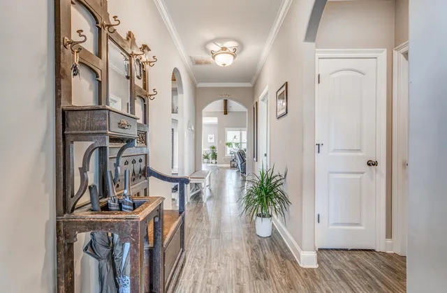 a view of balcony with furniture and wooden floor