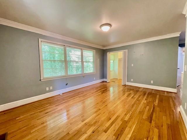 2396 Lavista Road Northeast Atlanta, GA 30329 - Photo 14 of 28 a view of an empty room with wooden floor and a window
