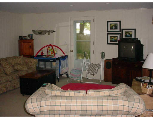 16 Spring Street Lexington, MA 02421 - Photo 6 of 8 a bedroom with a bed and a television
