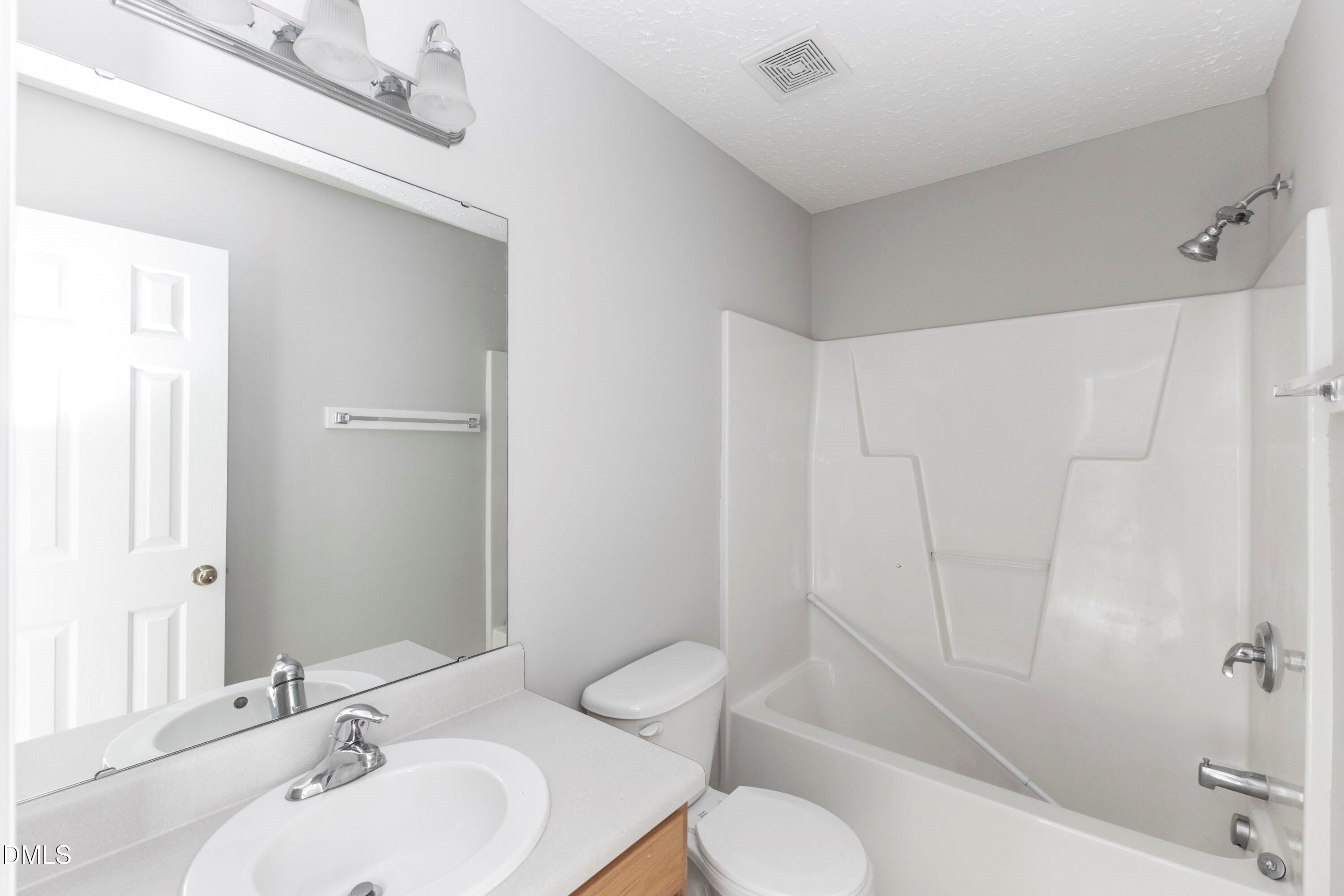 3358 Tarleton West Durham, NC 27713 - Photo 17 of 23 a bathroom with a sink toilet and shower