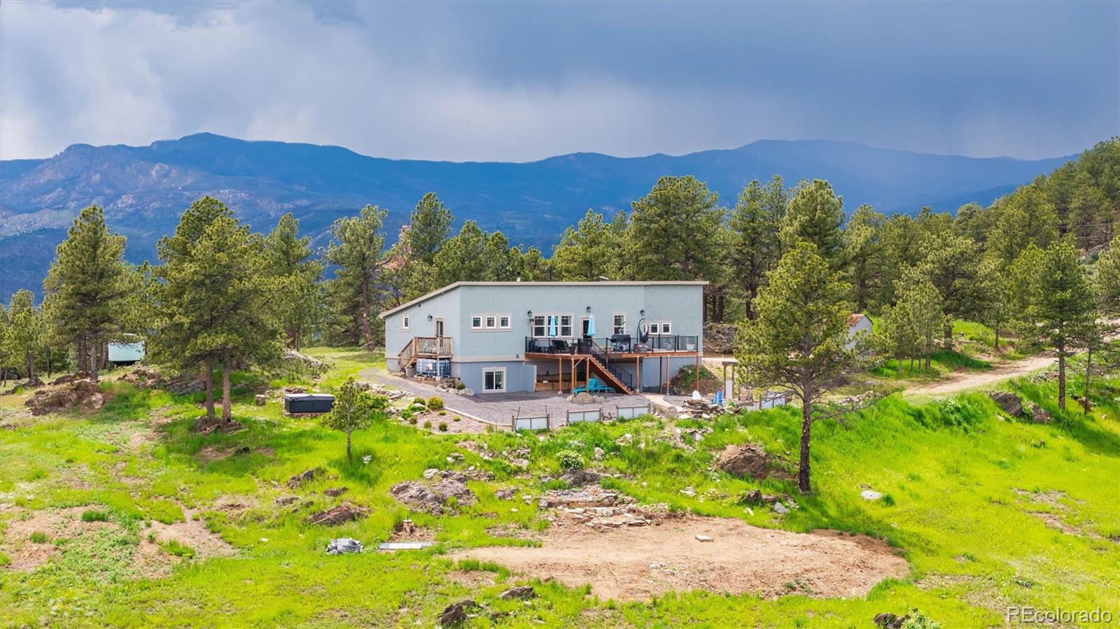 13328 Otter Road Loveland, CO 80538 - Photo 2 of 43 a view of a city with lush green forest