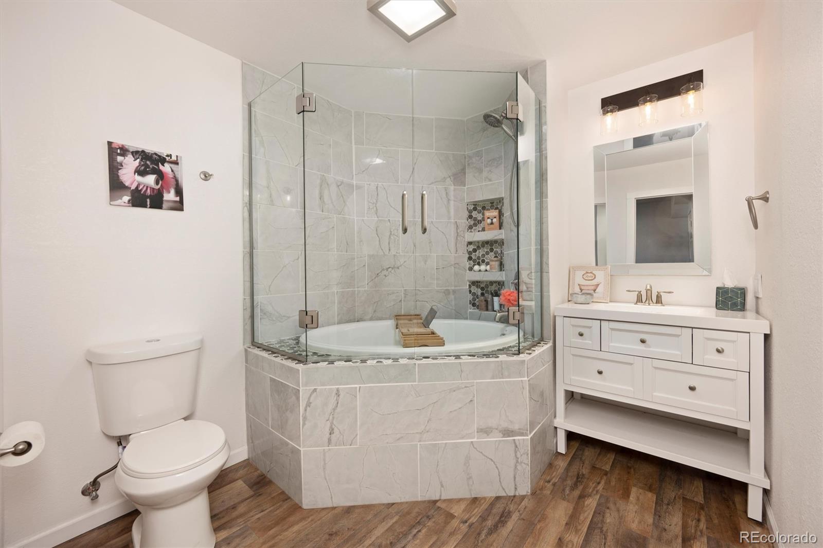 13328 Otter Road Loveland, CO 80538 - Photo 27 of 43 a bathroom with a sink toilet and shower