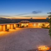 a view of an swimming pool with an outdoor seating