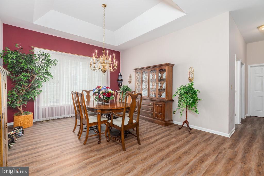 11324 River Run Lane Berlin, MD 21811 - Photo 14 of 50 a view of a dining room with furniture and wooden floor