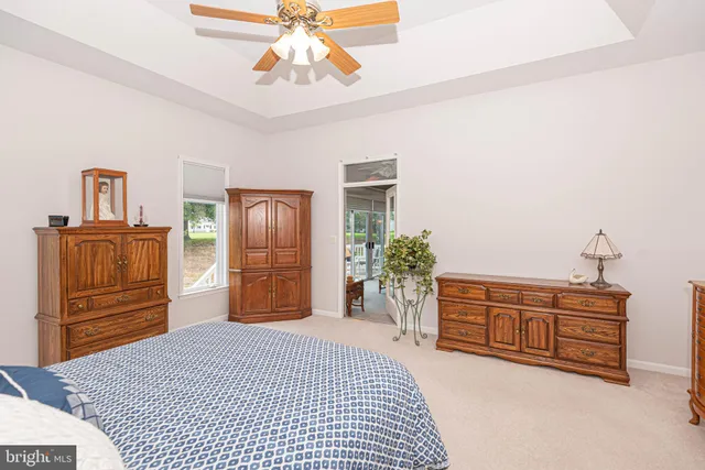 a bedroom with a bed and dresser