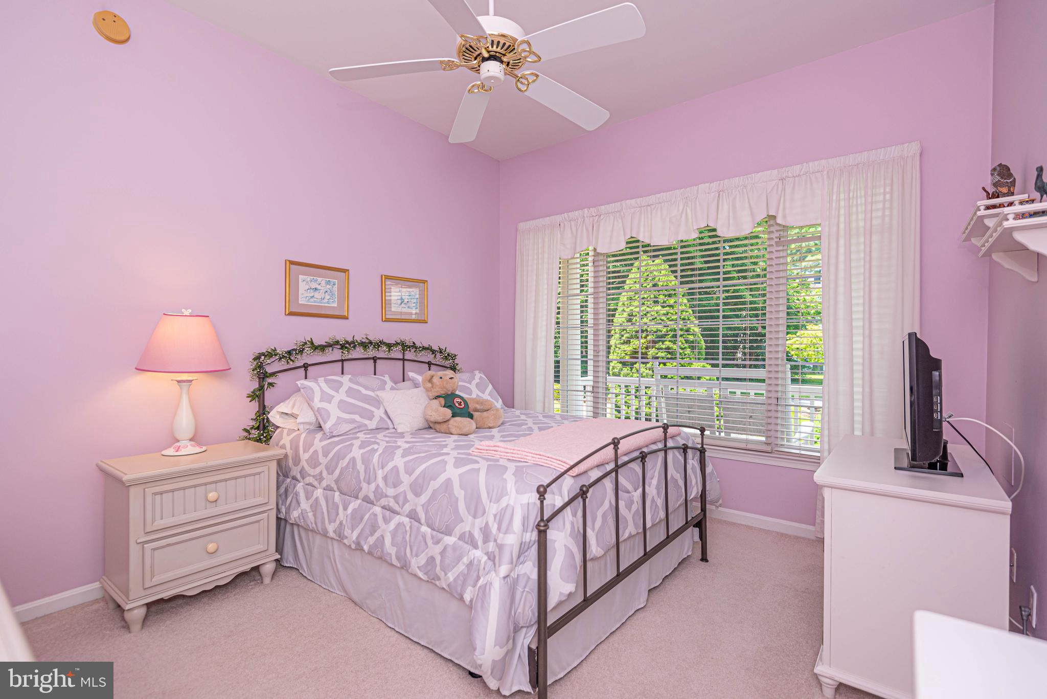 11324 River Run Lane Berlin, MD 21811 - Photo 27 of 50 a bedroom with a bed and a chandelier