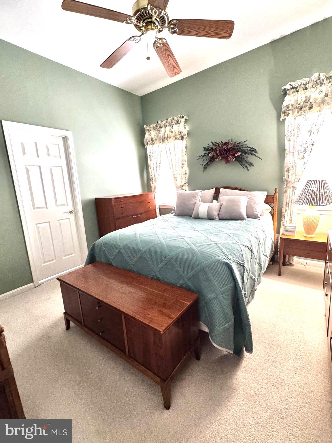 11324 River Run Lane Berlin, MD 21811 - Photo 29 of 50 a bedroom with a bed and a chandelier