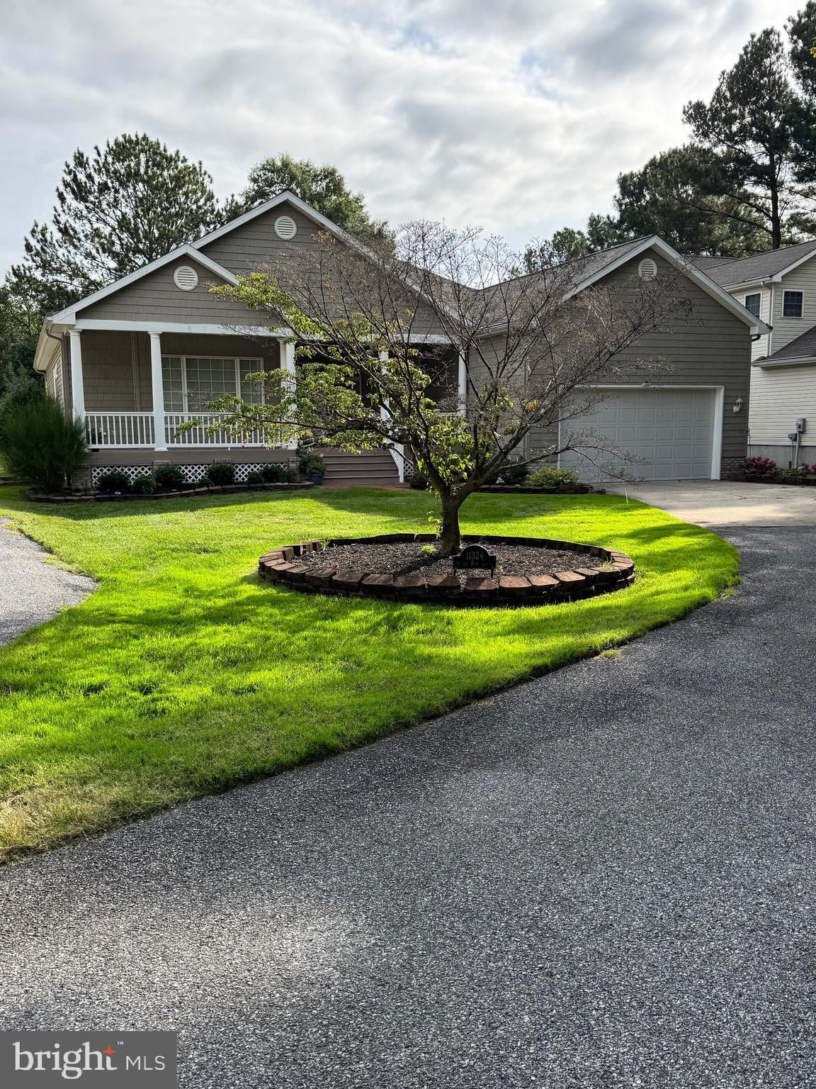 11324 River Run Lane Berlin, MD 21811 - Photo 39 of 50 a front view of a house with a yard and trees