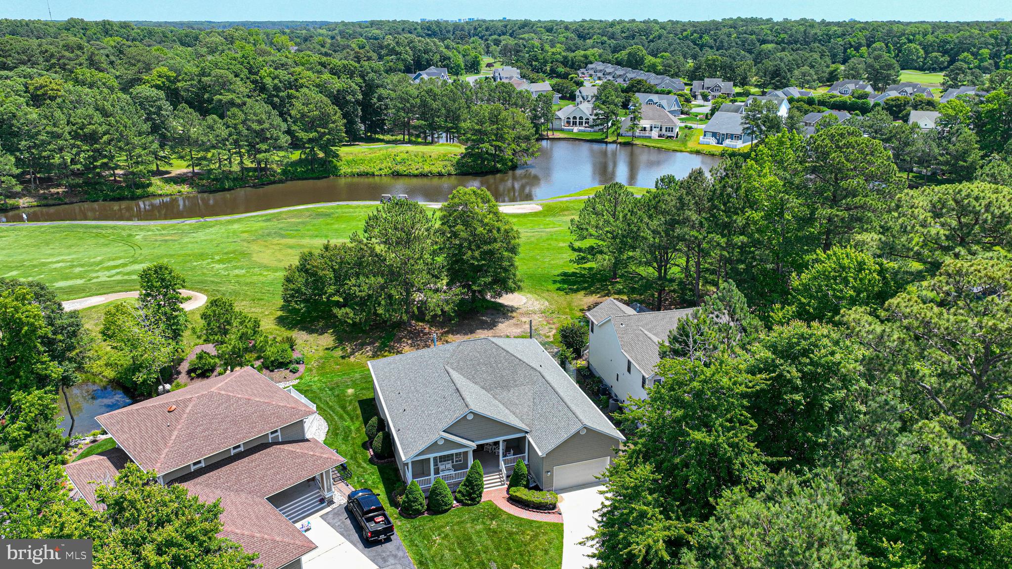 11324 River Run Lane Berlin, MD 21811 - Photo 41 of 50 an aerial view of a house with a yard and lake view
