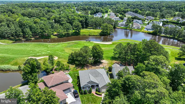 an aerial view of house with yard swimming pool and outdoor seating