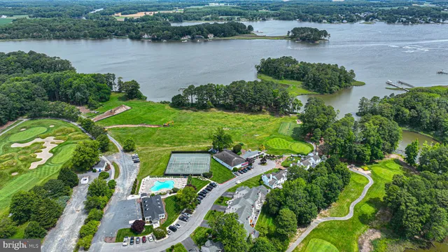 an aerial view of a house with a lake view