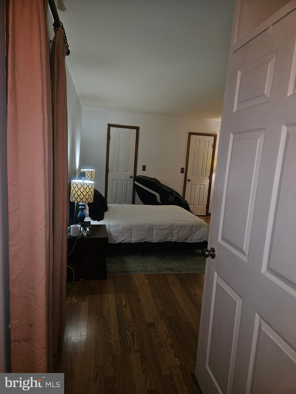 4202 Lakeview Parkway Locust Grove, VA 22508 - Photo 17 of 32 a bedroom with a bed and wooden floor