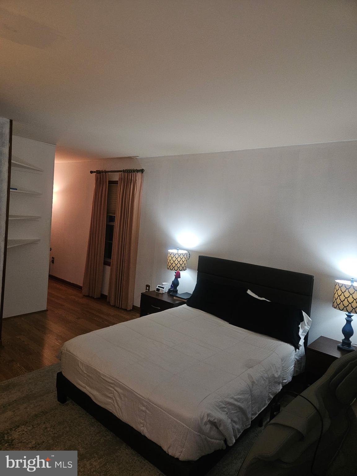 4202 Lakeview Parkway Locust Grove, VA 22508 - Photo 18 of 32 a bedroom with a bed and wooden floor