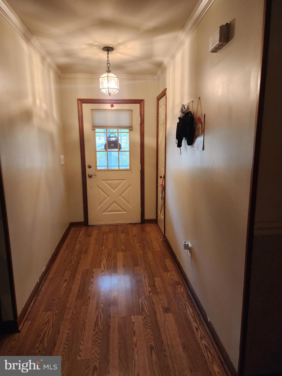 4202 Lakeview Parkway Locust Grove, VA 22508 - Photo 2 of 32 a view of a hallway with wooden floor