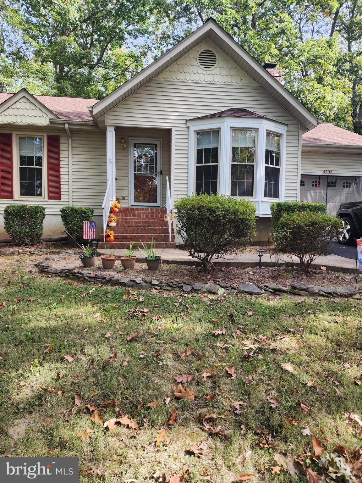 4202 Lakeview Parkway Locust Grove, VA 22508 - Photo 30 of 32 a view of a house with backyard and sitting area
