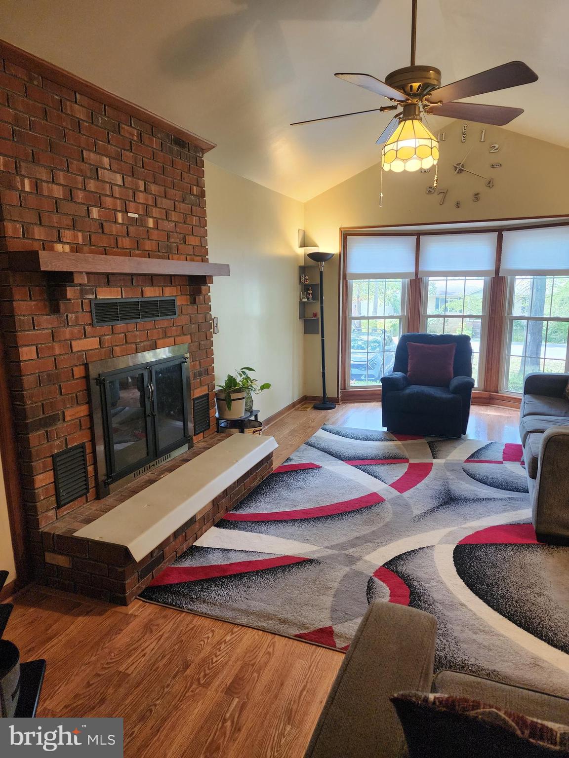 4202 Lakeview Parkway Locust Grove, VA 22508 - Photo 4 of 32 a living room with furniture a chandelier and a fireplace