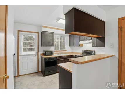 a kitchen that has a sink and a stove