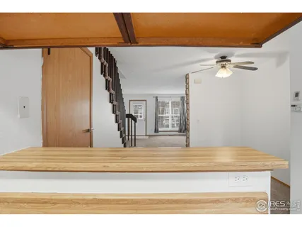 a view of a bedroom with a bed and a chandelier