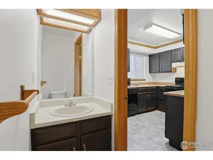 a kitchen with a sink and a refrigerator