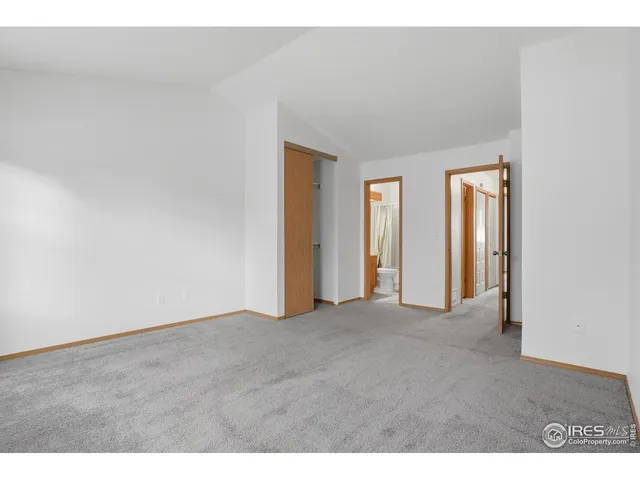 a bathroom with a granite countertop sink toilet a mirror and a bathtub