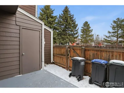 a backyard of a house with barbeque oven