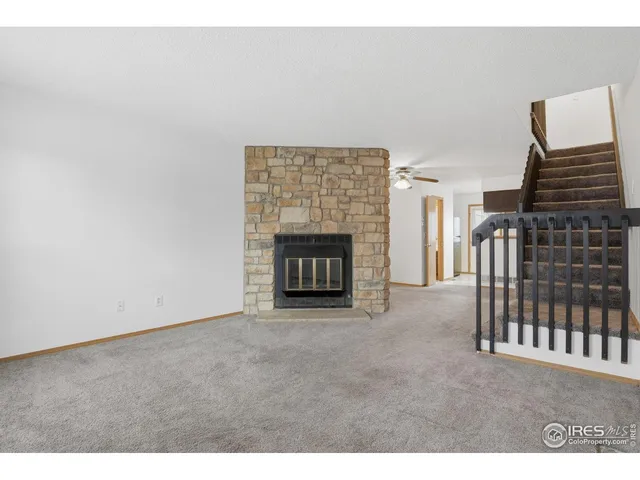 a view of an empty room with glass door