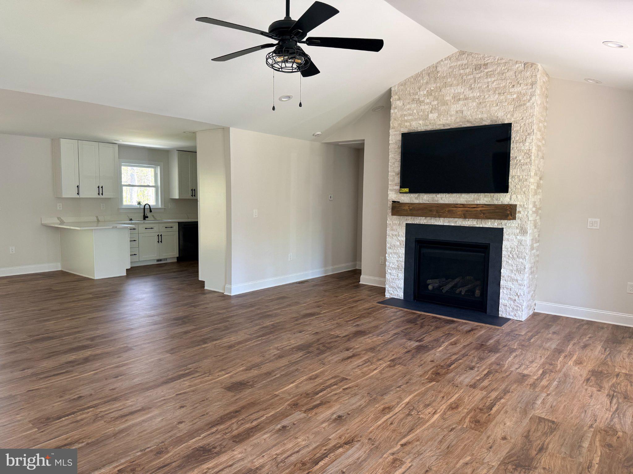 206 Saylers Creek Road Locust Grove, VA 22508 - Photo 20 of 49 a view of empty room with wooden floor and fireplace