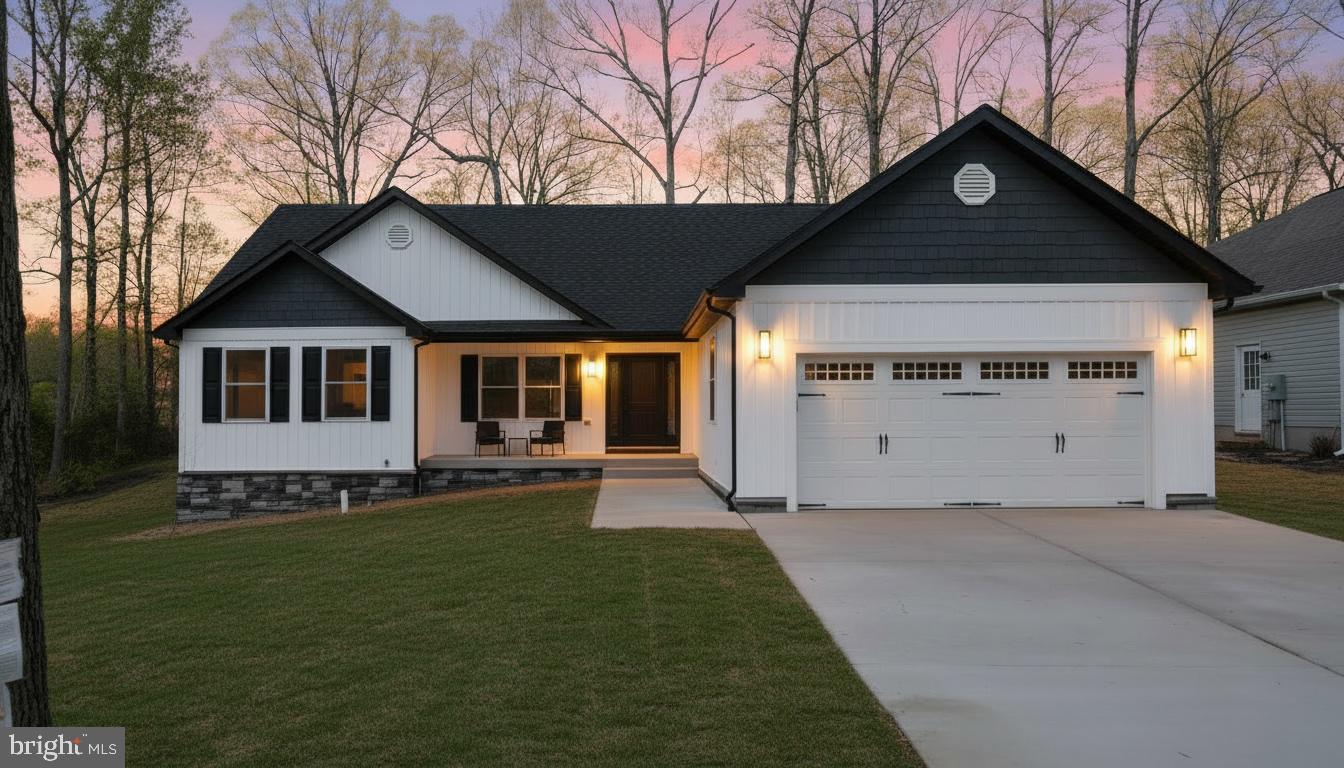 206 Saylers Creek Road Locust Grove, VA 22508 - Photo 2 of 49 a front view of a house with a garden and yard
