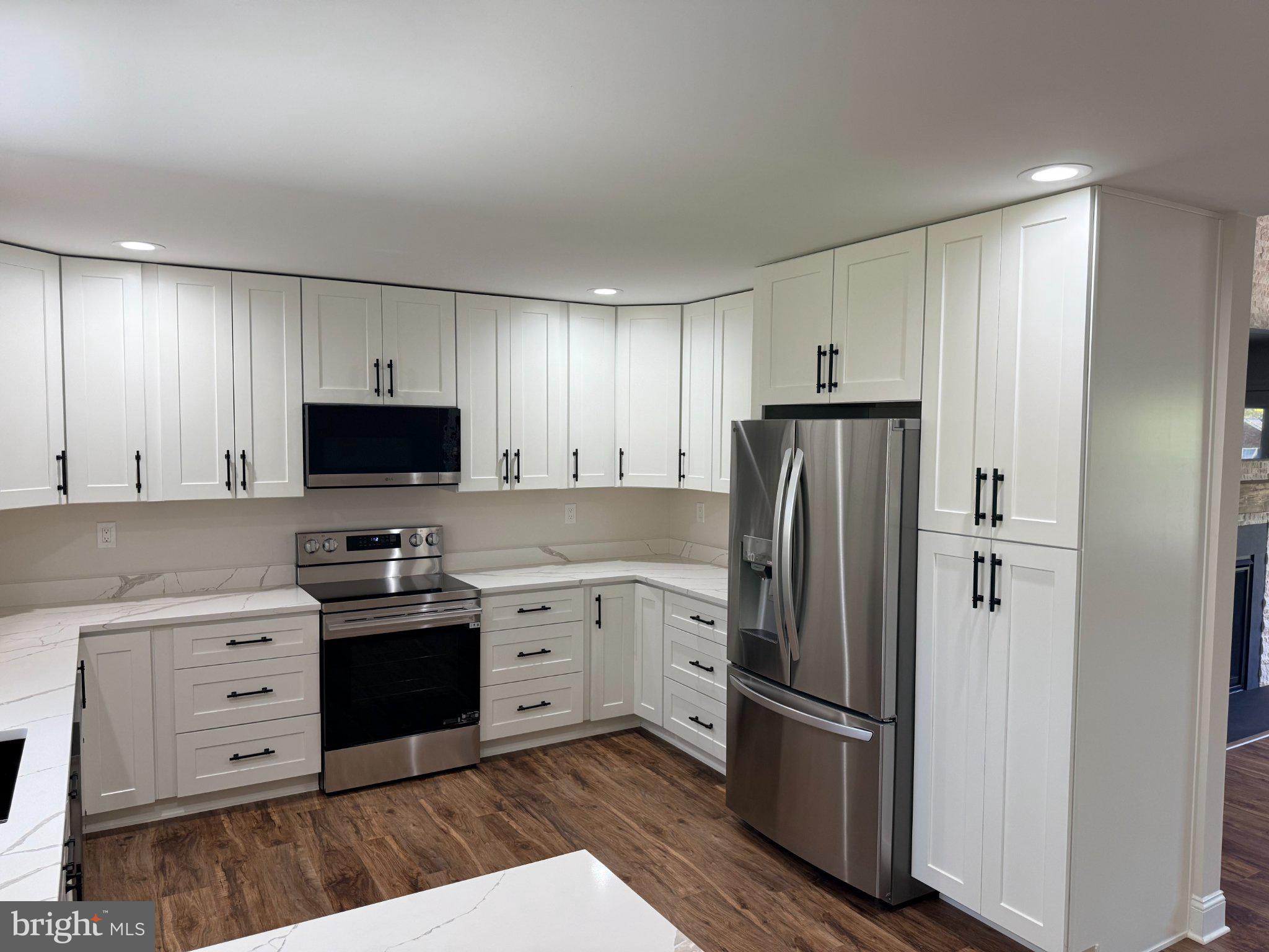 206 Saylers Creek Road Locust Grove, VA 22508 - Photo 21 of 49 a kitchen with stainless steel appliances granite countertop a refrigerator stove and sink