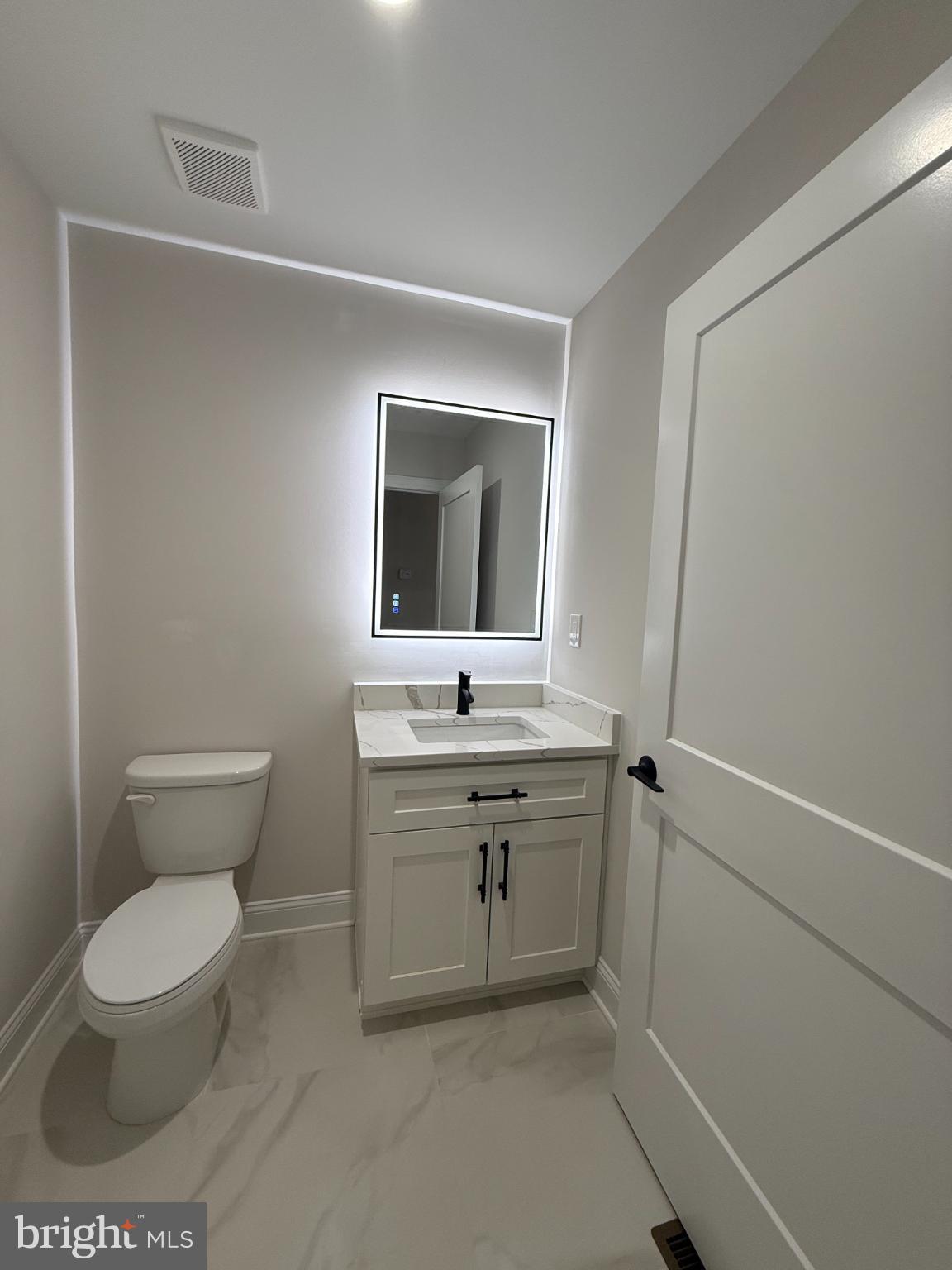 206 Saylers Creek Road Locust Grove, VA 22508 - Photo 22 of 42 a bathroom with a toilet sink and mirror