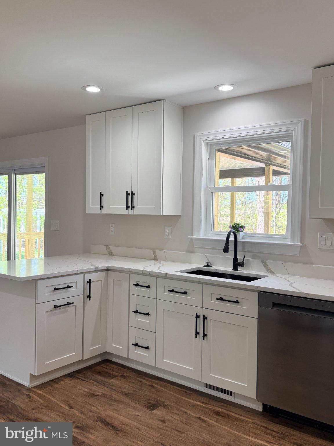 206 Saylers Creek Road Locust Grove, VA 22508 - Photo 23 of 49 a kitchen with a sink stove and cabinets